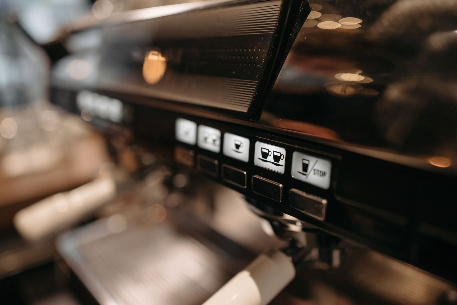 The espresso machine, shot close and thrown out of focus.