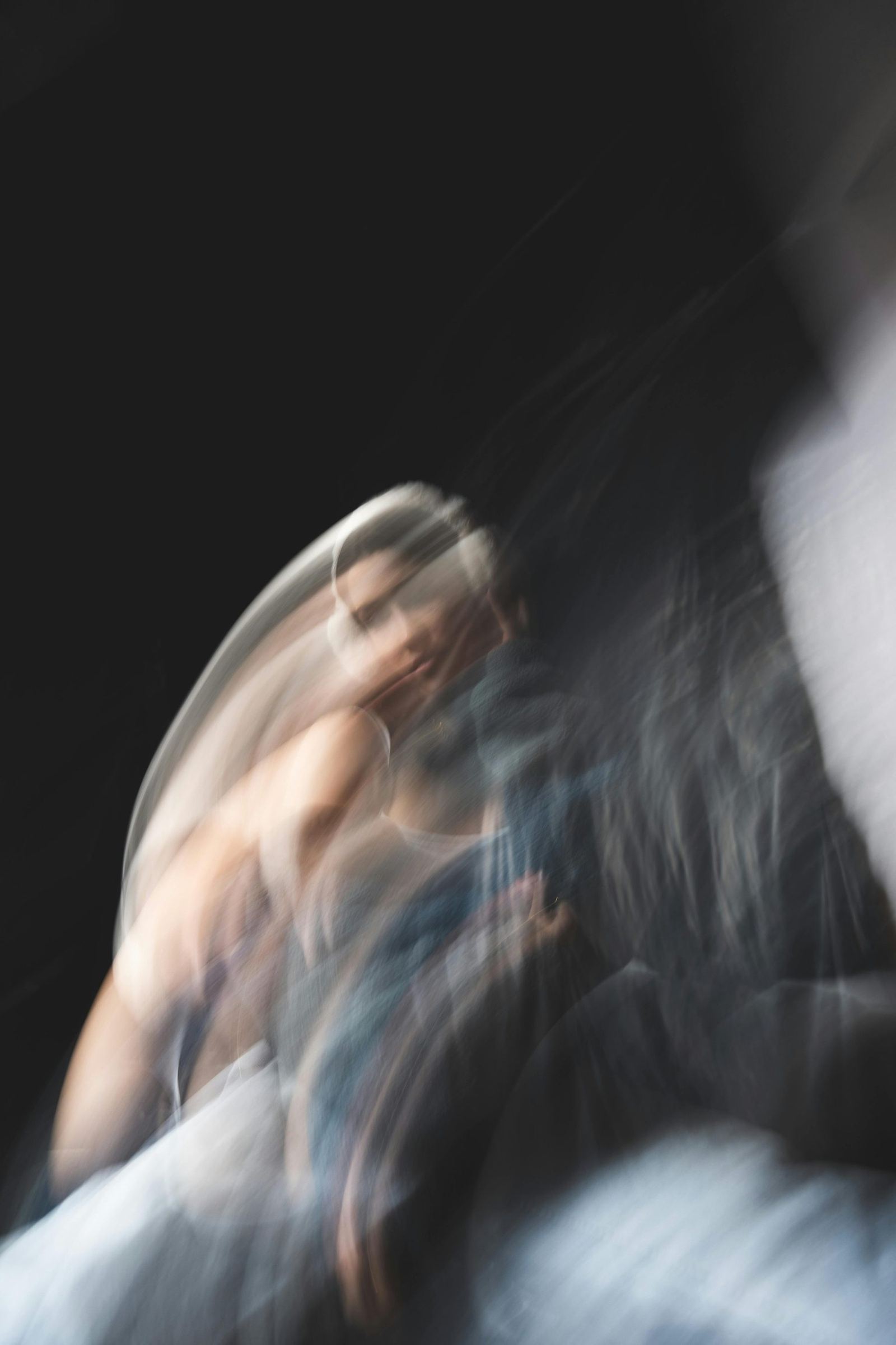 Blurred image showing a person with sweeping motion.