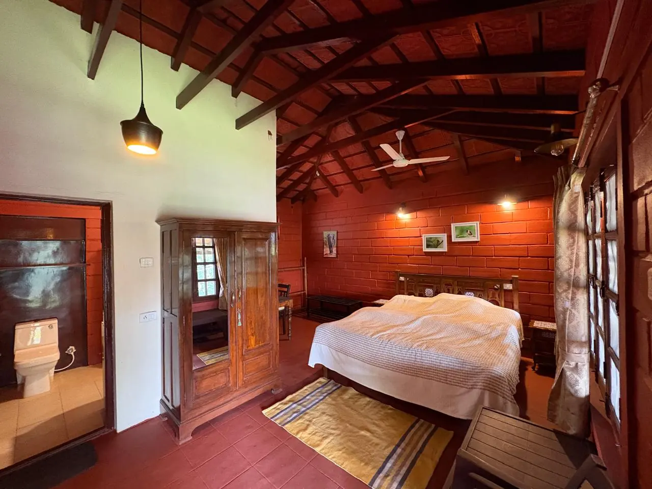 Yercaud Club chamber with a timber ceiling, wooden floor and double bed