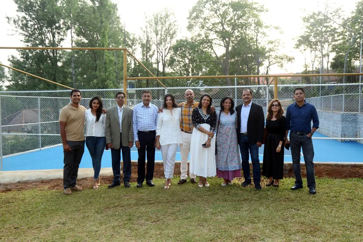 Yercaud Club members gathered beside the tennis court